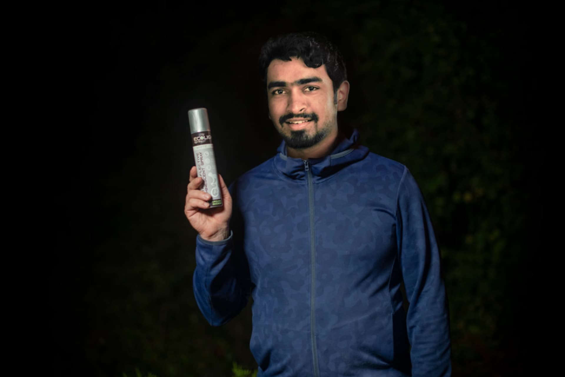 EcoLite spray can held by the team